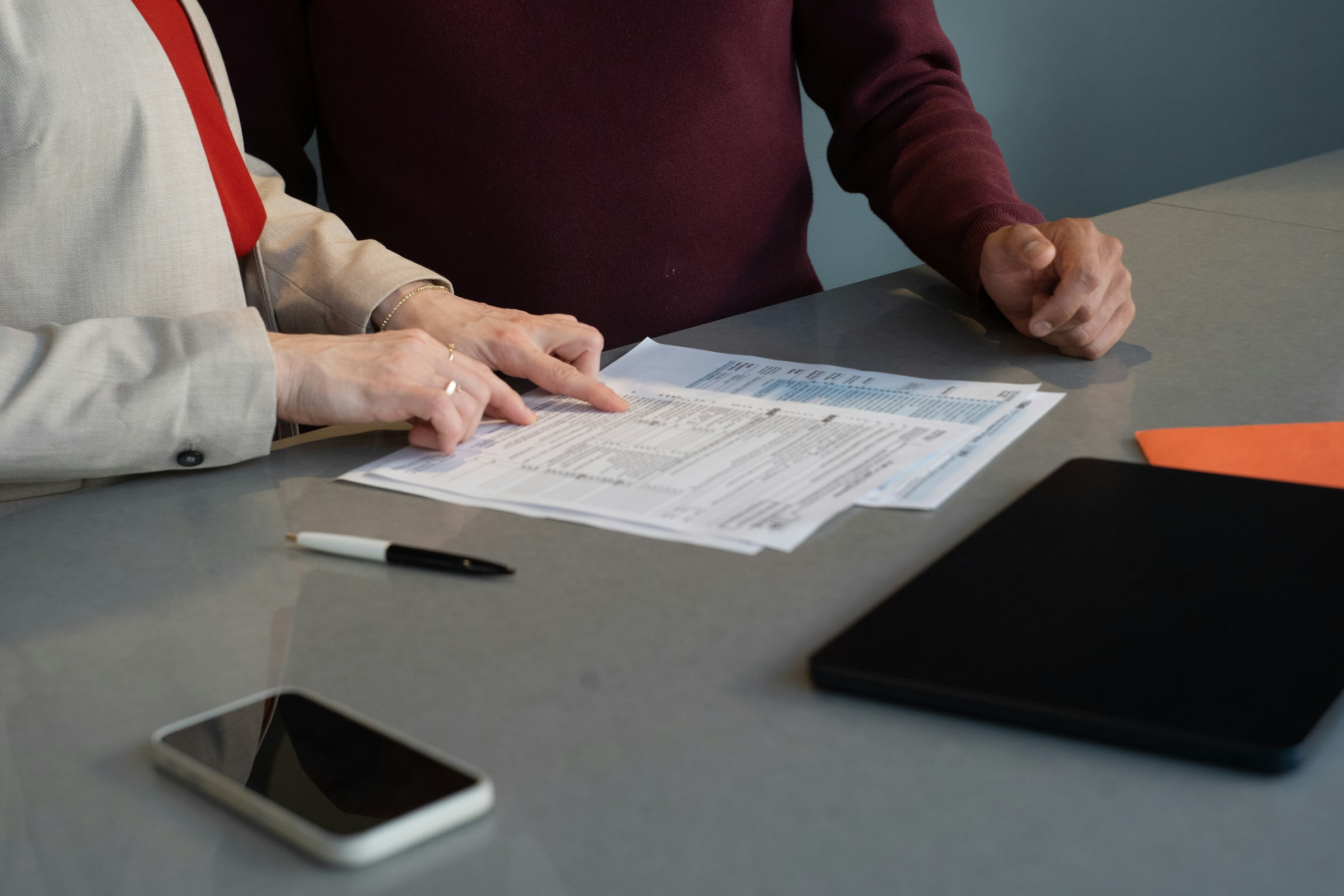 Professionals going through detailed financial records